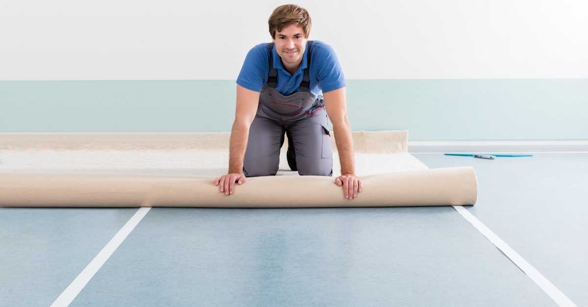 aman applying double sided carpet tape