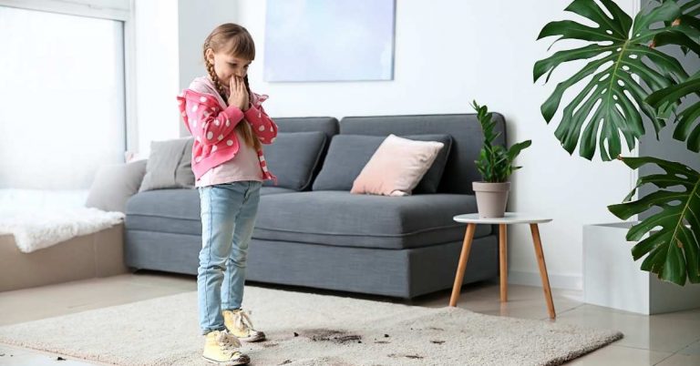 a girl standing on a dirty carpet which need a plastic carpet protector